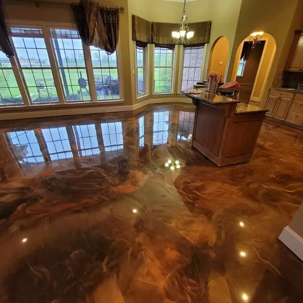 Marbled metallic epoxy floor with flowing reflective pigment in a Sarasota County interior